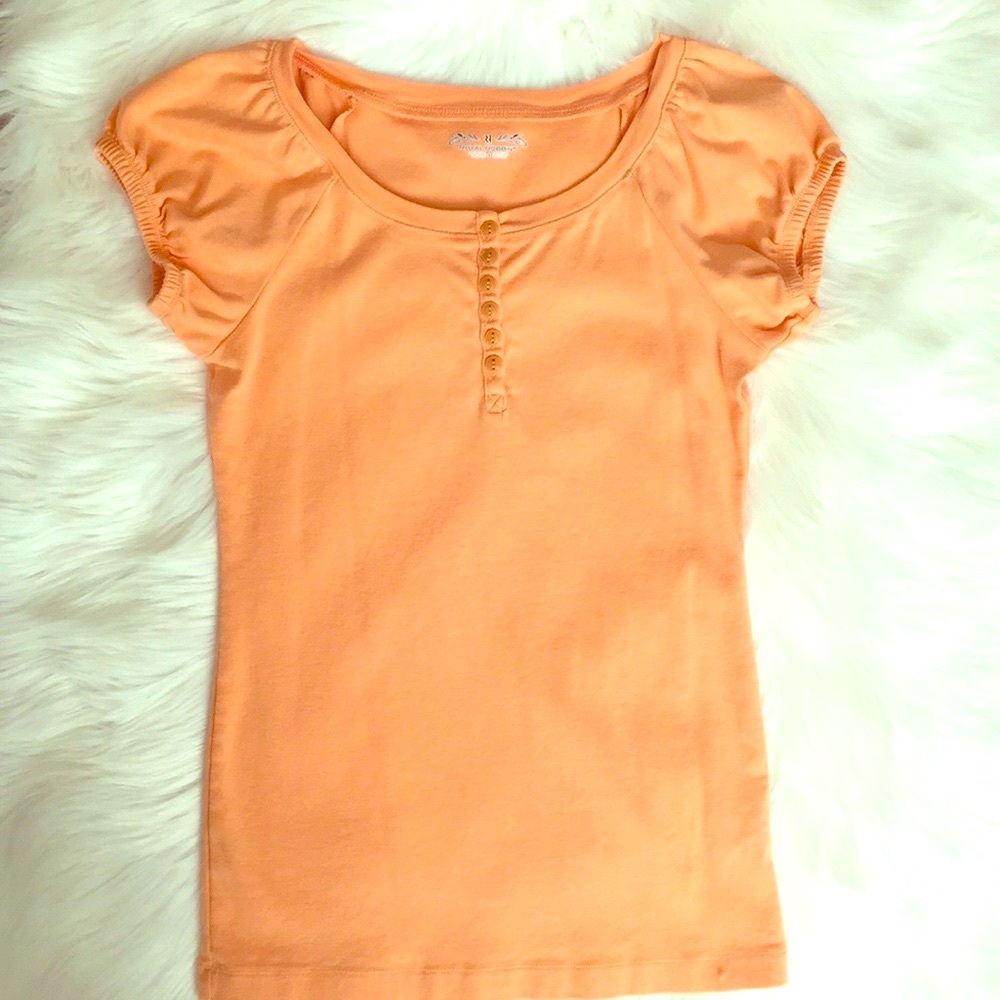 Light colored orange shirt